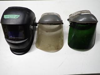 (3) Welding Helmets, Regulators & Torch Tips.