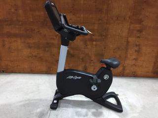 Life Fitness Model 95CS Life Cycle Inspire Upright Bike c/w KOPS Leg Position, Programmed Workouts & Touchscreen Display. S/N APU118513.