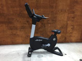 Life Fitness Model 95CS Life Cycle Inspire Upright Bike c/w KOPS Leg Position, Programmed Workouts & Touchscreen Display. S/N APU114970.