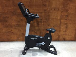 Life Fitness Model 95CS Life Cycle Inspire Upright Bike c/w KOPS Leg Position, Programmed Workouts & Touchscreen Display. S/N APU114960.