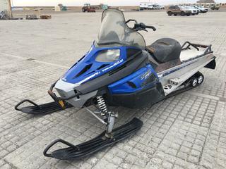 2012 Arctic Cat Snowmobile c/w 570cc, Auto, Showing 9,714 Kms, VIN 4UF12SNW3CT104842. *Note: Starts & Runs, Ripped Seat, Cracked Plastic, Windshield Cracked On Right Corner, Starter Is Weak.