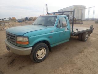 1997 Ford F-350 XL 4X2 Flat Deck Truck C/w 5.8L EFI, Manual, 10ft X 7ft Steel Deck, Headache Rack, Record No 6 Vise, 7.50-16LT Spare Tire And LT215/85 R16 Tires. Showing 300,053Kms. VIN 1FDKF37H1VEB95536. *Note: No Keys, Running Condition Unknown, Window Handle Missing, Front Seat Damaged, Muffler Requires Repair And (3) Lights Missing Lens In Back Bumper*