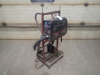 Lincoln Electric LN-25 Wire Feeder C/w Cart. SN U1990511945 *Note: Case Cracked, Working Condition Unknown*