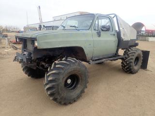 1987 Chevrolet 4X4 Pickup C/w 468 Big Block 550hp LPG Gas Engine, Edelbrock V8, Built 700R4 A/T Transmission, 7ft Box, Trail Master Suspension, Oversized Aluminum Rad w/ Dual Electric Fans, PSC Hyd Steering, NP241 Transfer Case, Hydraulic Steering Cooler, Night Switch On Frame, Corporate 14 Rear Diff w/ 5:3 Gears w/ Detroit Locker, Dana 60 Front Diff w/ 5:13 Gears And Eaton Electric Locker, Warn 9.5 TI 9500lb Winch, 40in X 26in X 24in Aluminum Storage Box, (2) Propane Tanks And 18.4-16.1 Tractor Tires Showing 230,438kms. VIN 1GCEV14H8HJ115027 *Note: Windshield Cracked, Holes And Tears On Side Canopy, Information As Per Consignor* 