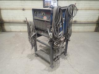 1997 Miller Dimension 302 230/460/575V 3-Phase CC/CV.DC Welding Power Source C/w Cable And Stand. SN KH500299