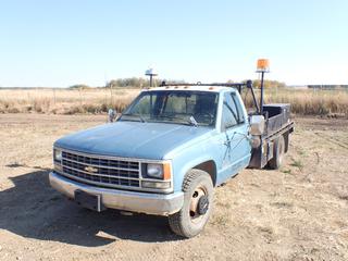 1991 Chevrolet Cheyenne 3500 Single Cab Flat Deck Truck c/w 5.7L, Dually, Manual, A/C, Storage Cabinet, Welding Deck, Hydraulic System, 235/85R16 Tires, Extra Set of Tires and Rims, (2) Buyers Storage Box On Deck,  Showing 140,403 Miles, VIN 1GBJC34K0ME173460 *Note: Boost To Start, Engine Light On, Battery Light On, Rust* (PL0383)