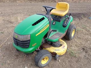 John Deere L100 Lawn Tractor c/w Briggs & Stratton Intek 17 HP OHV, 42 In. Cutting Blade *Note: Flat Tire, Working Condition Unknown*