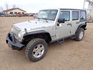 2007 Jeep Wrangler Unlimited Rubicon 4X4 SUV c/w 3.8L V6, 6 Speed, A/C, RC Side Steps, Soft Cover, Window Trim, LT255/75R17 Tires, Spare Tire, GVWR 5,550 LB, Front Axle 2,650 LB, Rear Axle 3,200 LB, Showing 200,818 Kms, VIN 1J8GA69117L190984 *Note: Smokes On Start, Tailgate Stiff, Driver Seat Ripped, Stain On Rear Seat, Minor Rust On Hinges/Body*