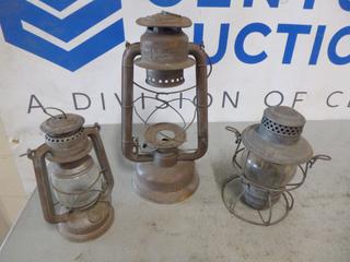 (1) Beacon Lantern, Guaranteed Wind Proof, (1) Feuerhand Lantern, No. 275, (1) CNR Kerosene Lantern