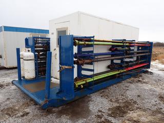 Enclosed Production Testing Pipe Skid c/w Contents, Overall Size Approx 25 Ft. x 10 Ft. x 9 Ft., Building Size Approx 10 Ft. x 6 Ft. x 8 Ft. **Located Offsite Near Clyde, AB, For More Information Contact Chris 587-340-9961**