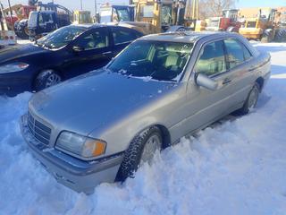 1999 Mercedes-Benz C230 Sport Sedan c/w Kompressor 2.3L V6, A/T, A/C, Sunroof, 195/60R15 Tires, VIN WDBHA24G9XF838245, *Note: No Key, Mileage & Working Condition Unknown, Scrape On Back Bumper, Driver Side Mirror Damaged, Buyer Responsible For Loadout* 
**Located Offsite at 21220-107 Avenue NW, Edmonton, For More Information Contact Richard at 780-222-8309**