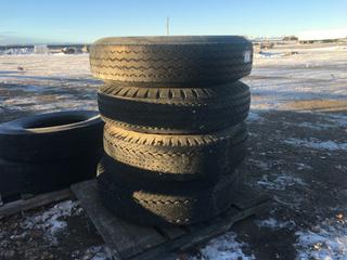 (4) Toyo Tires 10.00 R22 M-87, c/w (1) Bud Rim and (3) Dayton Rims.