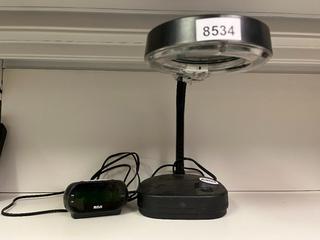 EuroTool Model LMP-120 Magnifying Lamp and RCA Digital Alarm Clock.