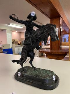 Frederic Remington "In Woolly Chaps" Bronze Statue. Approximately 24 in. Height, Weighs Approximately 50 Pounds.