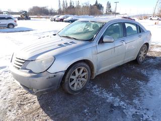 2007 Chrysler Sebring Touring Sedan c/w 2.7L DOHC 24 Valve, A/T, A/C, Sunroof, P215/55R18 Tires, Showing 180,417 Kms, VIN 1C3LC56R37N541620 *Note: Back Window Missing, Rear Bumper Hanging Off, Front Bumper Needs To Be Reattached, Front Windshield Smashed, Battery Wired In Trunk*