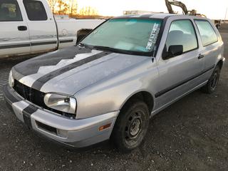1993 Volkswagen Golf 2 Door Hatch Back Car c/w 1.8 4 Cyl., 5 Spd, Showing 275,580 Kms VIN 3VWAN01H3PM044329. *Note: Hole In Transmission, Motor Runs, No Battery, No Radio, Panel & Glove Box In Parts In Car, Tail Light Cracked, Missing Driverside Panel Inside Of Door, Missing Shift Knob, No Headlight On Driverside, No Grill In Front Of Rad, No Exhaust*