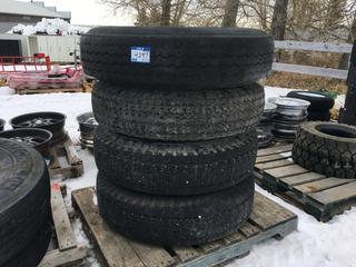 (4) Toyo Tires 10.00 R22 M-87 c/w (1) Bud Rim and (3) Dayton Rims.