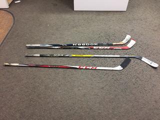 (4) Hockey Sticks.