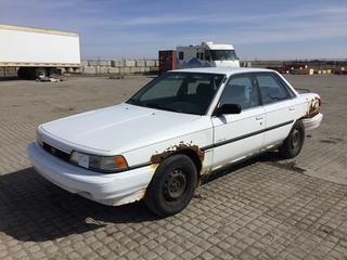 1990 Toyota Camry SE 4 Door Car c/w 16 Valve Inline 4, Auto, 195/70R14 Tires, Showing 190,047 Kms, VIN JT2SV21F3L0358084, *Fenders Rusty, Tail Light Damaged, Passenger Side Door Doesn't Open*
