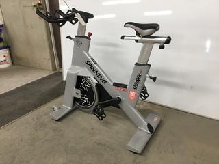 Star Trac NXT 7090 Spin Bike with Adjustable Seat, Dual Sided Pedals, Extra Durable Crank System, Push Brake Safety System, S/N SBEX0812-T13667.  (SC)