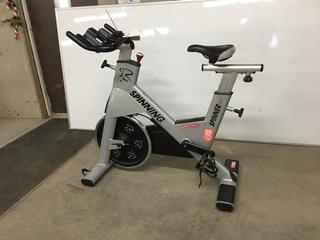 Star Trac NXT 7090 Spin Bike with Adjustable Seat, Dual Sided Pedals, Extra Durable Crank System, Push Brake Safety System, S/N SBEN1301-L01801.  (SC)