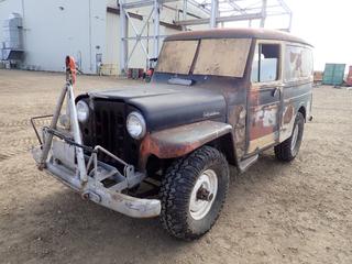 Willys Overland Motors Jeep, 4WD, c/w 4 Cyl, Manual Transmission, Leather Seats, Showing 58,431 Miles, SN 452-FA1 10891, LT285/75R16 Tires, c/w Winch and Front Tow Bar, *Note: Runs, Parts Inside, No Windshield*