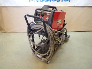 Lincoln Electric MIG-Pak 180 MIG Welder c/w 30-180A, 208/230V, Single Phase, Stand, Welding Helmet and Gloves. SN M3150703750  (H)