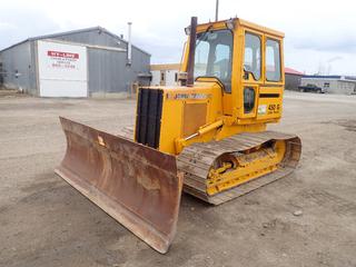 1991 John Deere 450G Long Track Crawler Dozer C/w John Deere Diesel Engine, 4-spd Powershift Transmission, 24in Single Grouser Tracks, 10ft Blade And 2in And 3-Pt Hitch Receivers. Showing 05153hrs. SN T0450GH777905