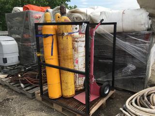 Bottle Rack w/ (3) Oxygen Tanks, (1) Propane Tank and (1) Tank Dolly.