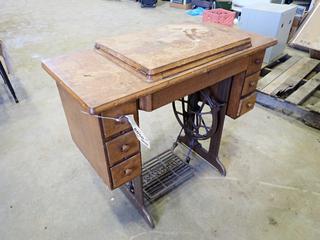 Antique 6-Drawer Sewing Table c/w Singer Sewing Machine And Foot Pedal. SN JA711560  (SC)