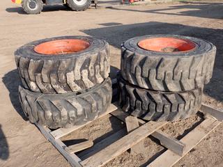 (4) Bobcat 10-16.5N.H.S. Heavy Duty Skid Steer Tires w/ Rims