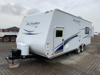 2010 Jayco Feather Jay EXP 20ft T/A Travel Trailer c/w Rear Slide Out, Fold Up Bunk Bed, Roof Top AC, LPG Heater, Fridge, Freezer, Gas Range, Microwave, Full Bathroom, TV, Multimedia Receiver, 2-5/16in Ball, 85/80R13 Tires, Manuals In Office. VIN 1UJBJ0BK0A1J30442.