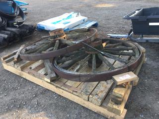 (2) Antique Wagon Wheels.