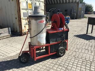 Hotsy Hot Water Pressure Washer 5Hp 230V 23Amp 60Hz Single Phase Baldor Motor on Pull Cart c/w Hose Reel, Hose and Nozzle.  (DOME)