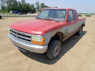 1992 Dodge Dakota LE Extended Cab 4X4 Pickup c/w 3.9L V6, A/T And 195/65 R15 Tires. Showing 297,574kms. VIN 1B7GG23X1NS582216 *Note: No Tailgate, Rust, No Catalytic Converter, Missing Radio* 
