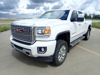 2018 GMC Sierra Denali 2500 HD Crew Cab 4X4 Pickup c/w 6.0L V8, A/T, Leather, Sunroof, Backup Camera, Built In Tire Air Compressor And LT305/55R20 Tires. Showing 222,101kms, 6140hrs. VIN 1GT12UEG5JF213097