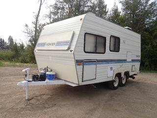 1988 Frontier FTL20 T/A 20 Ft. Travel Trailer c/w 2 5/16 In. Ball Hitch, 110-125V, 30Amp, 3998lb GVWR, Hydro Flame Propane Furnace, Dometic Propane/Electric Fridge, Coleman TSR AC/Heater Fan, Bathroom And ST225/75R15 Tires. VIN 2VHFT2007J10C9043 *Note: Minor Water Damage On Wall In Bathroom, Tires Recently Changed*
