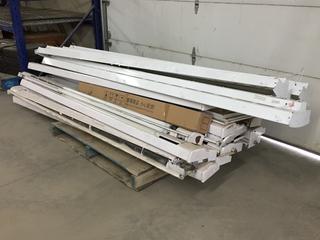 Pallet of Baseboard Heaters and Fluorescent Light Fixtures. (WH)