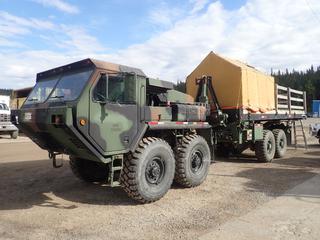2004 Oshkosh 4X4 MK48 T/A All Terrain Transport Vehicle w/ Detroit 460hp Diesel Engine, A/T, 32,000lb GVWR, 16,000lb GAWR, Oshkosh MK18A1 T/A Rear Body Unit, DP Mfg 20K5284 20,000lb Winch, Tilt Deck, 24ft X 8ft Steel Flat Deck, 24ft X 8ft Wood Skid, 9 1/2ft X 8ft X 7ft Tent, Seacan Loader Winch Attachment And 16.00R21 Tires. Showing 163hrs, 779 Miles. VIN 10T4P8B98K1037299 **LOCATED IN HINTON, AB**