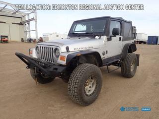 Fort Saskatchewan Location - 2004 Jeep Wrangler Rubicon c/w 4.0L, 6-Cyl, 5-Spd Manual Transmission, 4X4, Soft Top Cover, Lift Kit, Warn 9.5XP 9500lb 12VDC Winch And 35X12.50R17 Tires. Showing 164,536kms. VIN 1J4FA69S04P734305 *Note: Check Engine Indicator On, Tires, Brakes And Bearing Changed Recently As Per Consignor* 