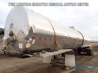 Fort Saskatchewan Location - 1980 38 Ft. 7 In. X 6 Ft. X 6 Ft. T/A, 6700 US Gal. Max Transportation Equipment Tank Trailer w/ 5th Wheel Hitch c/w 6 Ft. X 3 Ft. Under Body Storage, Spring Susp, 11R22.5 Tires. SN 2411B10 *Note: Broken Jack Stand, Torn Fender, Rust And Dents On Body*