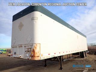 Fort Saskatchewan Location - Fruehauf 46 Ft. 8 Ft. 5 In. T/A Van Trailer c/w Under Carriage Storage w/ Contents, (4) 7 Ft. X 3 Ft. Bolt Bins, Spring Susp, 11R22.5 Tires. VIN DX2168804 *Note: Broken Back Door Hatch, Rust And Dents On Body*