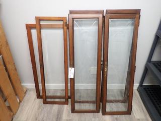 Qty of (4) 47 3/4 In. x 14 1/2 In. Vintage Glass Cabinet Doors c/w (1) 45 In. x 13 3/4 In. Cabinet Door and 41 1/4 In. x 21 1/4 In. Door Frame **Note: Buyer Responsible For Load Out, Located Offsite @ 493 Sioux Road,  Sherwood Park, AB, For More Details Contact 780-944-9144**