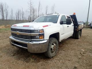2015 Chevrolet Silverado 3500HD 4X4 Dually Flat Deck Truck c/w Vortec 6.0L, A/T, 13,200lb GVWR, 9ft X 92in Deck, Hidden Fifth Wheel Hitch And LT235/80R17 Tires. Showing 147,358kms. VIN 1GB4KYCG3FF107895 *Note: Runs, Missing Bolt In Engine Block, Leaking Coolant, Tears On Seat*