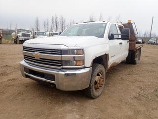 2015 Chevrolet Silverado 3500HD 4X4 Crew Cab Dually Flat Deck Truck c/w 6L V8 Vortec, A/T, 13,200lb GVWR, 9ft X 7 1/2ft Deck And LT235/80R17 Tires. Showing 252,788kms. VIN 1GB4KYCG0FF107613 *Note: Rust Throughout Body, Tears On Seat*