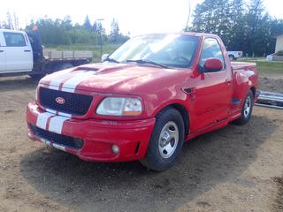 1998 Ford F150 SVT Regular Cab Pickup c/w 4.2L V6, A/T And 245/75R16 Tires. Showing 158,064kms. VIN 2FTZF0722WCB17268 *Note: Turns Over, Won't Start, Has Rust And Windshield Cracked, Body Parts and Repair Panels Under Box Cover, Out Of Province, Sold Bill Of Sale Only* (FORT SASKATCHEWAN YARD)