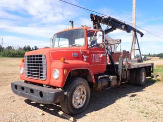 1981 Ford 9000 S/A Flat Deck Picker Truck c/w Detroit L-6 7.0L Diesel, Fuller Road Ranger RT-1110 10-Spd, Chelsea PTO, 22ft Prentice Hydraulic Picker, Spreader Bar, (2) Outriggers, 14ft X 8ft Deck, 222in WB And 11R22.5 Tires. Showing 18,036hrs, 288,844kms. VIN 1FDXR90J1BVJ11818 *Note: Rear Brakes Caged*