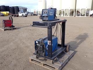 Miller XMT 450 230/460V 3-Phase CC/CV Welder, SN ME422543U, c/w Miller S-74 MPA Plus 24V Wire Feeder. SN MJ175013U **THIS ITEM IS LOCATED @ 5107 67 ST, LLOYDMINSTER, AB FOR MORE INFO CONTACT JASON @780-870-0193**