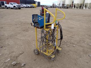 Miller S-75S 24V Single Phase Wire Feeder c/w Cart. SN LG200094W **THIS ITEM IS LOCATED @ 5107 67 ST, LLOYDMINSTER, AB FOR MORE INFO CONTACT JASON  @780-870-0193**