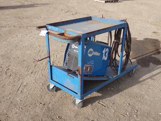 Miller XMT 350 208-575V 1/3-Phase Multi-Process Welder c/w Cart. SN LH040505A **THIS ITEM IS LOCATED @ 5107 67 ST, LLOYDMINSTER, AB FOR MORE INFO CONTACT JASON  @780-870-0193**